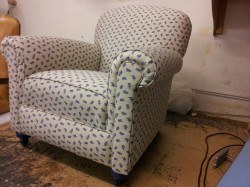 This is an armchair fully reupholstered 